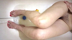 Sexy legs in the bath, dildo fucks hairy pussy, cum Thumb