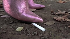 Crush by trampling a cigarette with long boots Thumb