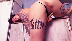 Big booty girl in the kitchen fucks herself with a banana Thumb